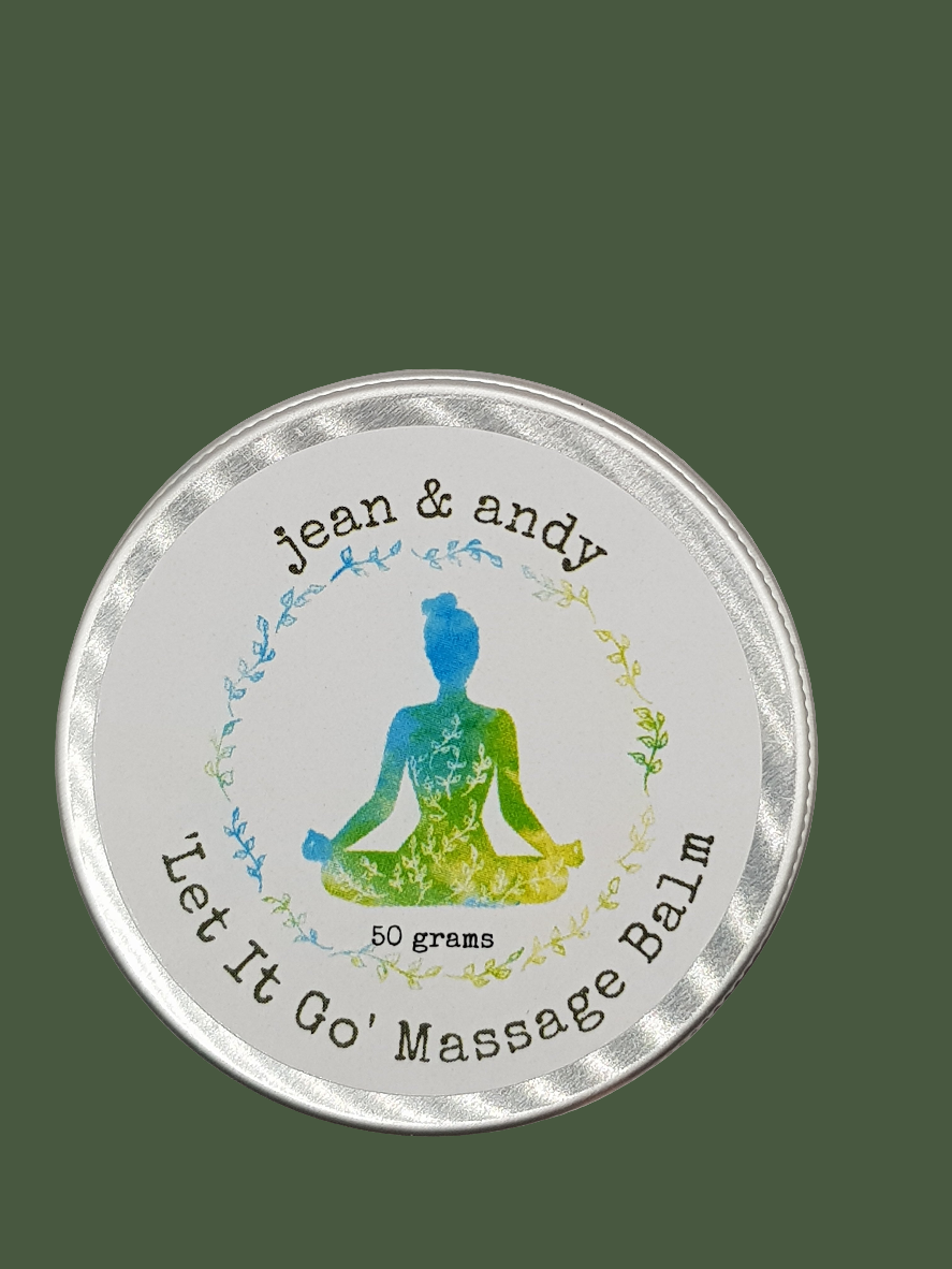 A round tin of Let It Go Massage Balm by jean & andy showcases a meditating figure on its label. The soothing experience is enriched with the aroma of essential oils. Below the figure, "50 grams" is elegantly centered within a circular motif of green and blue leaves.